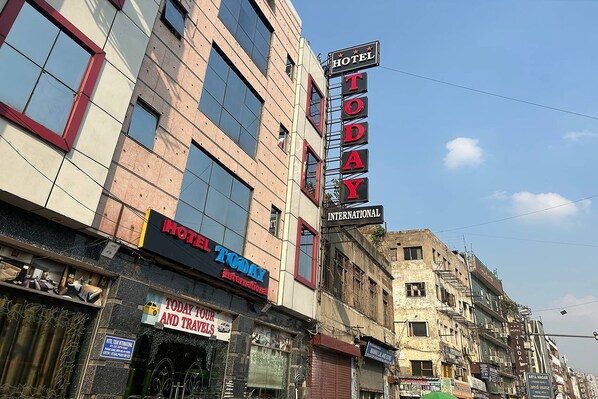 A hotel with a sign reading "HOTEL TODAY INTERNATIONAL" and another sign for "TODAY TOURS AND TRAVEL". - Hotel Today International (New Delhi)