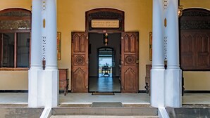 A grand entrance with a wooden door and a sign above it. - Amor Beach Unawatuna (Unawatuna)