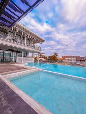 Outdoor pool, open 7:00 AM to 9:00 PM, free cabanas