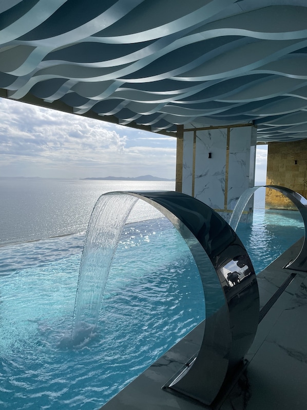 Indoor pool, 4 outdoor pools, open 8:00 AM to 9:00 PM, pool umbrellas