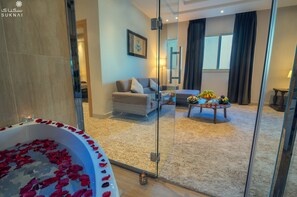 Signature Suite | Living area | 42-inch flat-screen TV with satellite channels