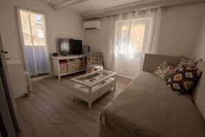 1 bedroom, desk, iron/ironing board, travel cot