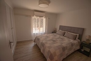 1 bedroom, desk, iron/ironing board, travel cot