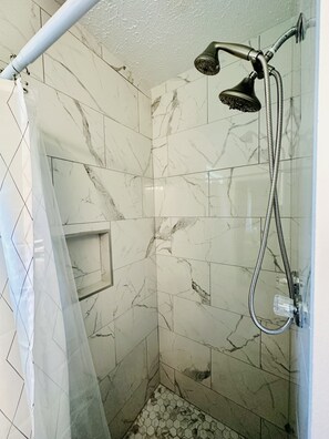 Shower, hair dryer, towels, toilet paper