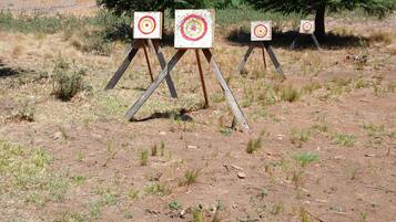 An outdoor shooting range with targets set up on stands.