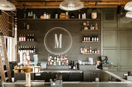 Bar (on property). Middlebrook Retreat, "Luxurious Retreat in Iowa's First Agrihood: Minutes to Des Moines & Steps to C...
