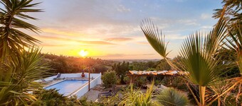 Hidden villa with pool and sea views, located in a green area.