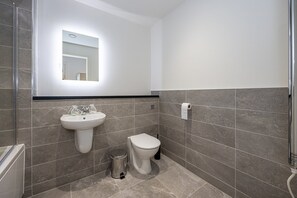 Bathtub, hair dryer, towels