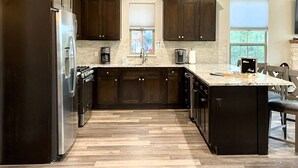 Coffee/tea maker, fridge, microwave, oven - Contemporary Waterfront Ranch Villa at Twin Canyons Longhorn Ranch (Granbury)