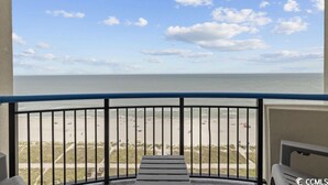 A balcony with a view of the beach and ocean. - Enjoy the Breathtaking View from Your Private Oceanfront Balcony (Myrtle Beach)
