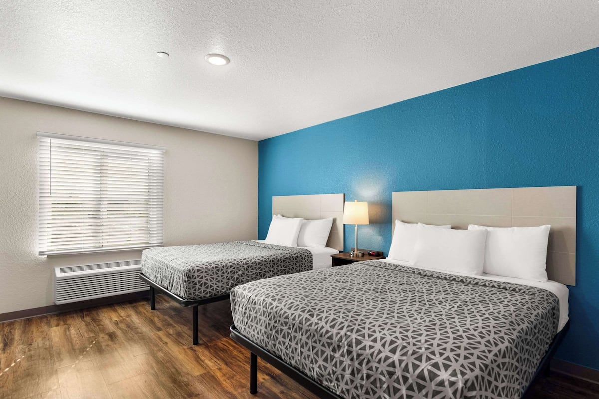 Individually furnished, desk, laptop workspace, bed sheets