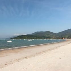 On the beach, white sand, beach umbrellas, beach yoga