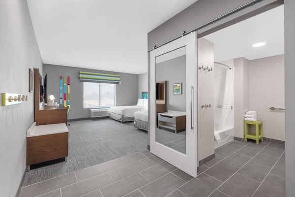 Room, 2 Queen Beds, Accessible, Bathtub (Mobility & Hearing, Bathtub) | Bathroom | Hair dryer, towels, soap, shampoo