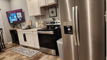 Chambre Luxe | Cuisine privée | CafetiÚre/bouilloire, tables à manger