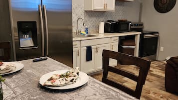 Luxury Room | Private kitchen | Coffee/tea maker, dining tables