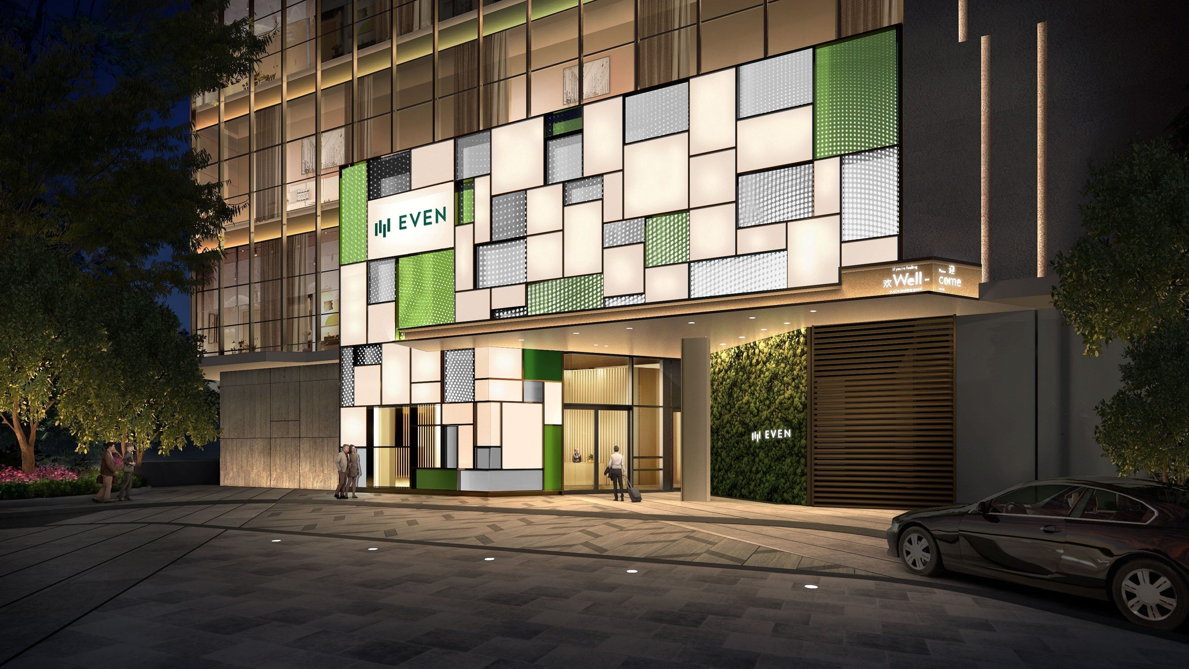 A modern building with a glass facade, labeled "EVEN," featuring a geometric pattern of windows and green accents.