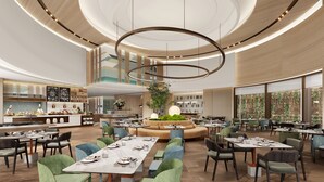 A spacious restaurant with multiple dining areas, a central seating arrangement, and a modern ceiling design. - EVEN Hotel Zhongshan City Center by IHG (Zhongshan)