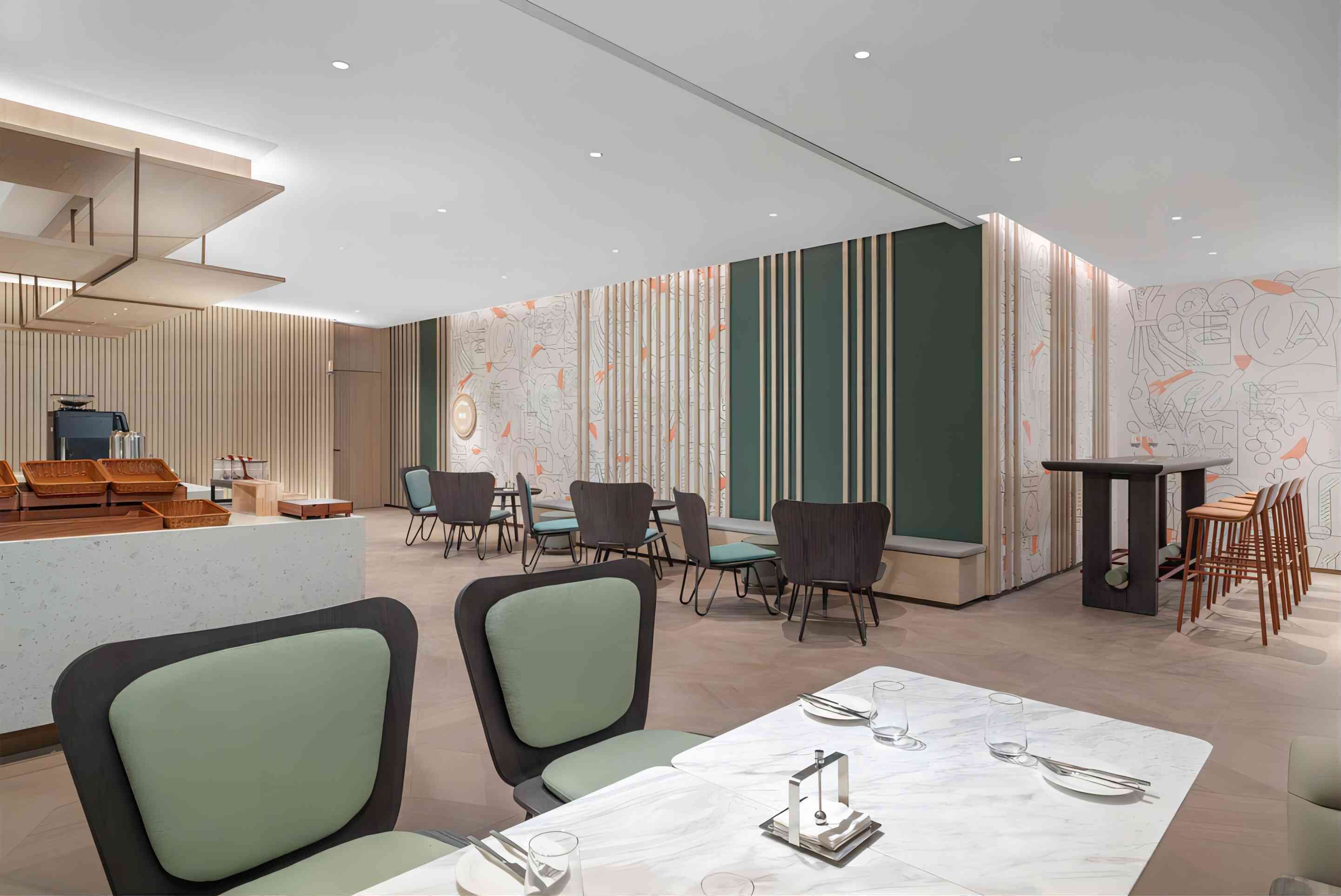 A modern restaurant with a clean, minimalist design, featuring a central dining area with tables and chairs, a counter with a coffee machine, and decorative wall panels.