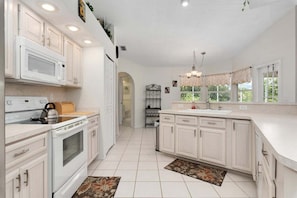 Fridge, microwave, oven, stovetop - Spacious 3/2 waterfront pool home in Port Charlotte - Scenic Solitude (Port Charlotte)