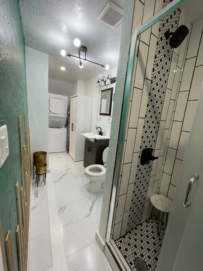 Shower, hair dryer, towels, soap