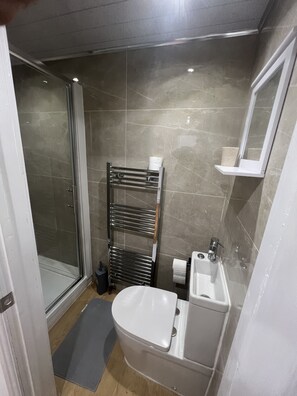 Shower, hair dryer, towels, soap