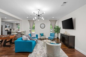 Smart TV, fireplace, table football, books
