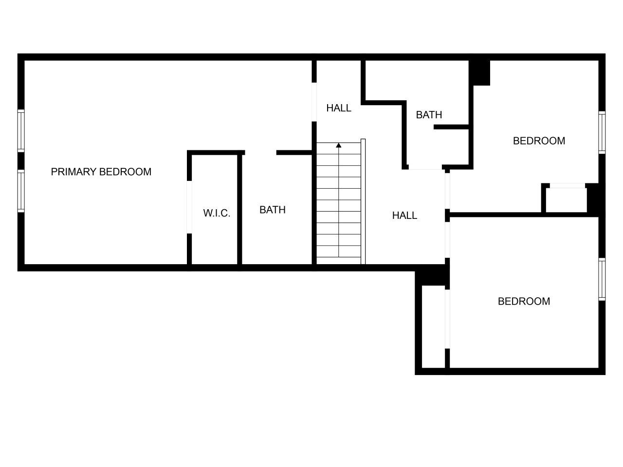 Un plan d’étage comprenant une chambre principale, deux salles de bain, un couloir et une chambre d’appoint.