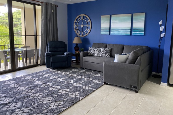 Lovely living room that steps out onto the spacious terrace overlooking the pool