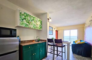 Panoramic Suite, 2 Bedrooms, Balcony, Beach View | Private kitchen | Fridge, microwave
