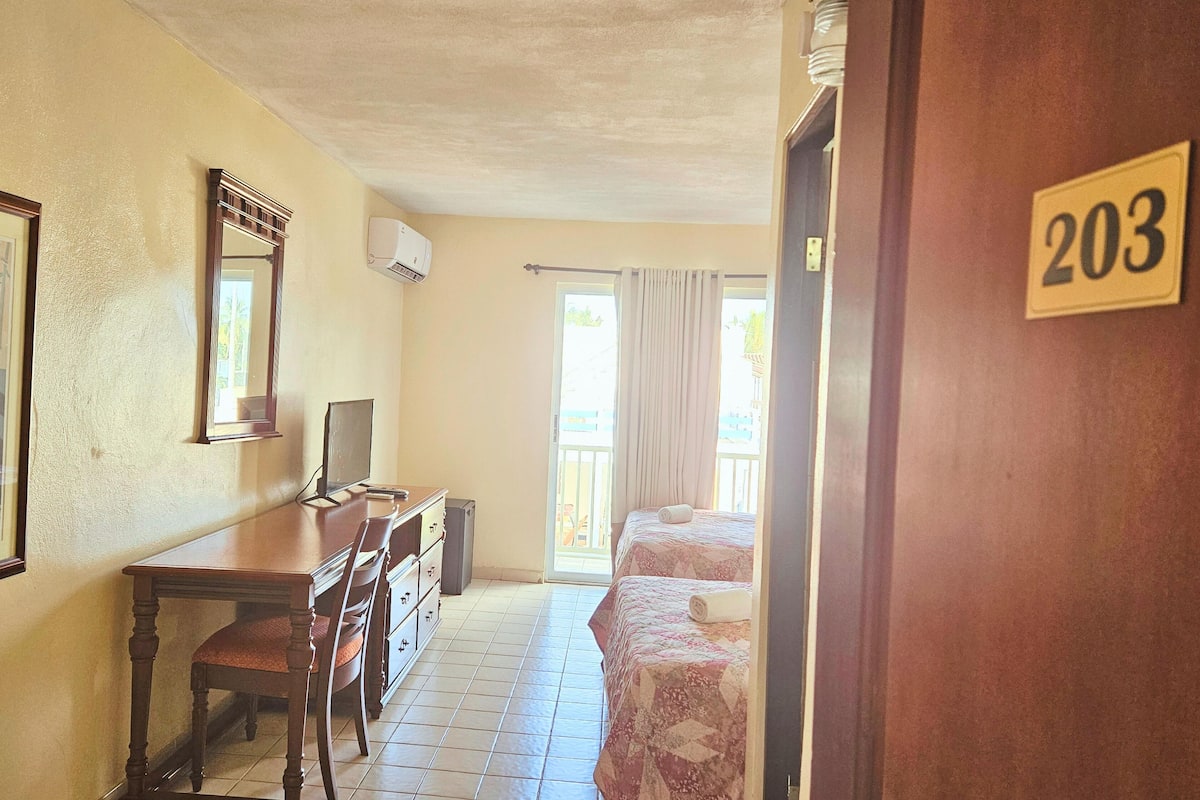 Premium Room, 2 Double Beds, Balcony, Partial Ocean View | Individually decorated, individually furnished, desk, laptop workspace