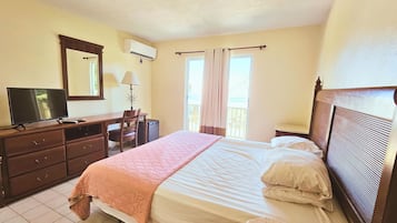 Premium Room, 1 King Bed, Balcony, Partial Ocean View | Individually decorated, individually furnished, desk, laptop workspace