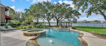 Lux Waterfront Home | 2 Primary Suites, 4 BR, Boat Dock & Views | Heated Pool & Spa
