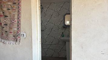 Panoramic Suite | Bathroom | Shower, rainfall showerhead, bathrobes, towels