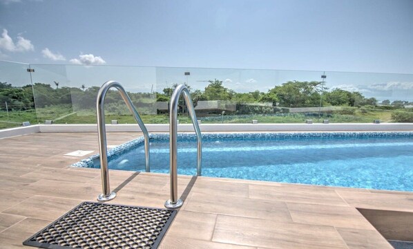 Private rooftop pool with grill