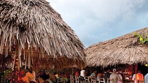 A beachside restaurant with thatched umbrellas and wooden tables. - Hospitality Expert CPA3: Pool/Beach/Hip-Strip (Montego Bay)
