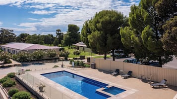 Outdoor pool, open 8:00 AM to 7:00 PM, pool umbrellas, pool loungers