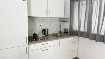 Fridge, stovetop, coffee/tea maker, cookware/dishes/utensils