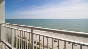 A balcony with a view of a beach and ocean. - Oceanfront 2 BR Condo tons of Amenities 9th Floor! (Myrtle Beach)