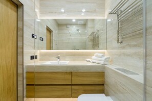 Departamento empresarial | Baño | Secadora de cabello, toallas, jabón, papel de baño 