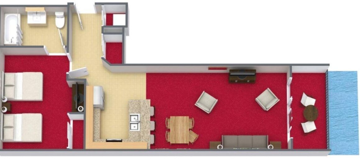 Indeling van een hotelkamer met een bed, zithoek en een kitchenette.