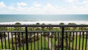 A balcony with a view of the beach and ocean. - Tranquil Tides 2BR Oceanfront Balcony (Myrtle Beach)