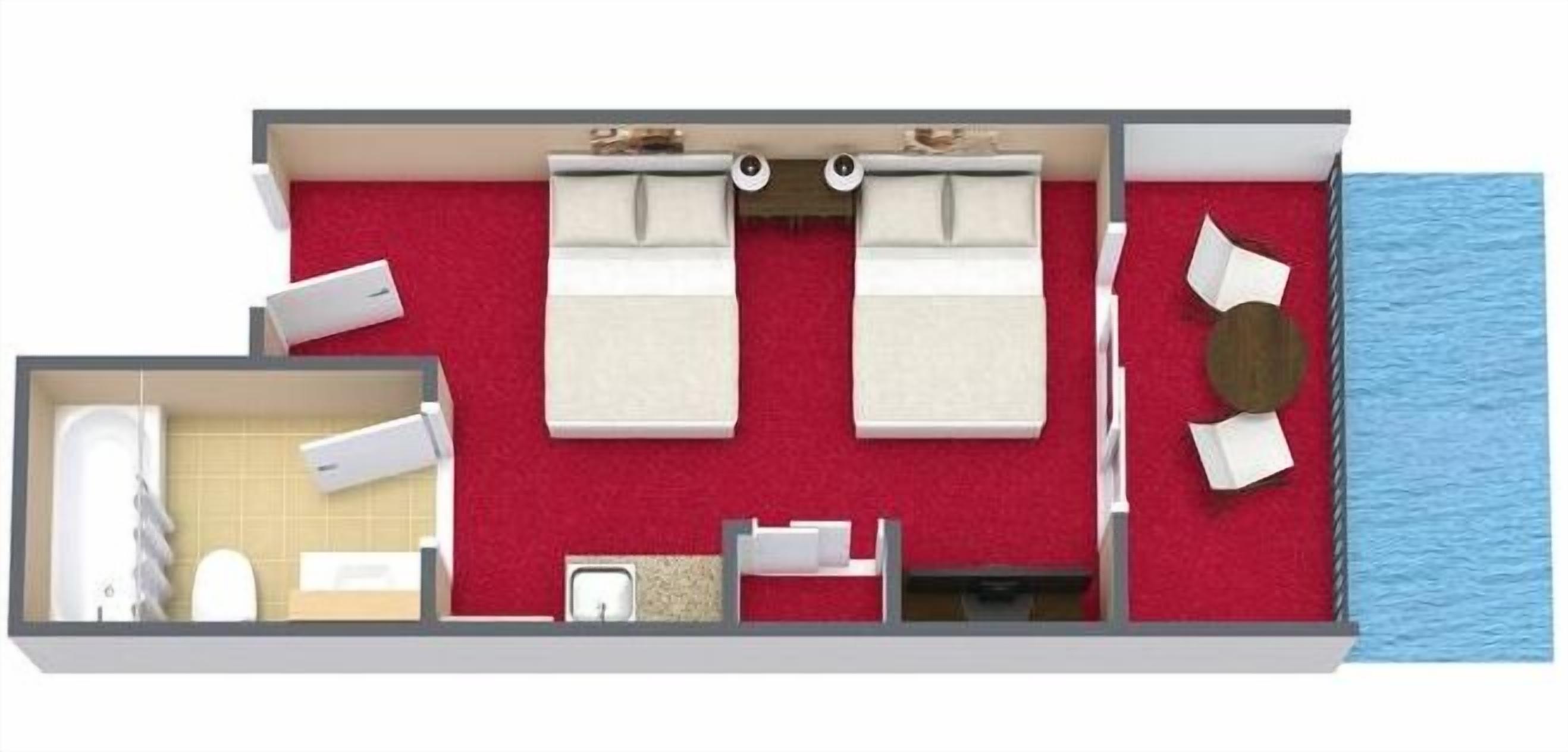 Ein Zimmer mit zwei Betten, einem Badezimmer, einer kleinen Sitzecke und Meerblick.