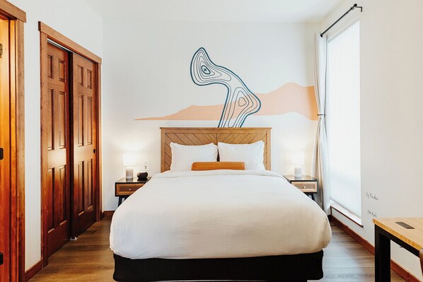 1 bedroom, desk, iron/ironing board, travel crib