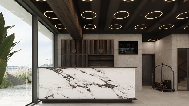 A modern reception desk with a marble top, a wooden ceiling with circular lights, and a view of the outdoors.