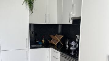 Fridge, microwave, oven, dining tables