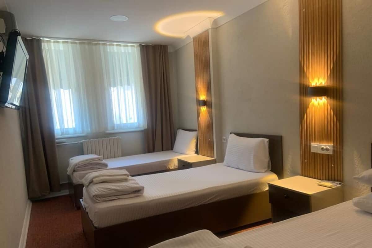 Standard-Dreibettzimmer | 1 Schlafzimmer, hochwertige Bettwaren, kostenloses WLAN, Bettwäsche