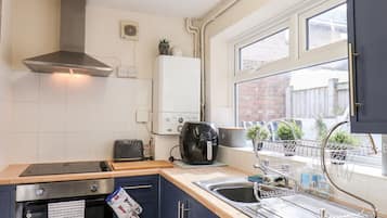 Fridge, electric kettle, toaster, cookware/dishes/utensils