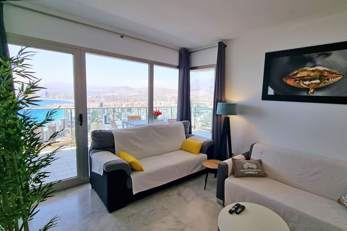 Deluxe Apartment, 2 Bedrooms, Sea View | Living area | 55-inch flat-screen TV with digital channels