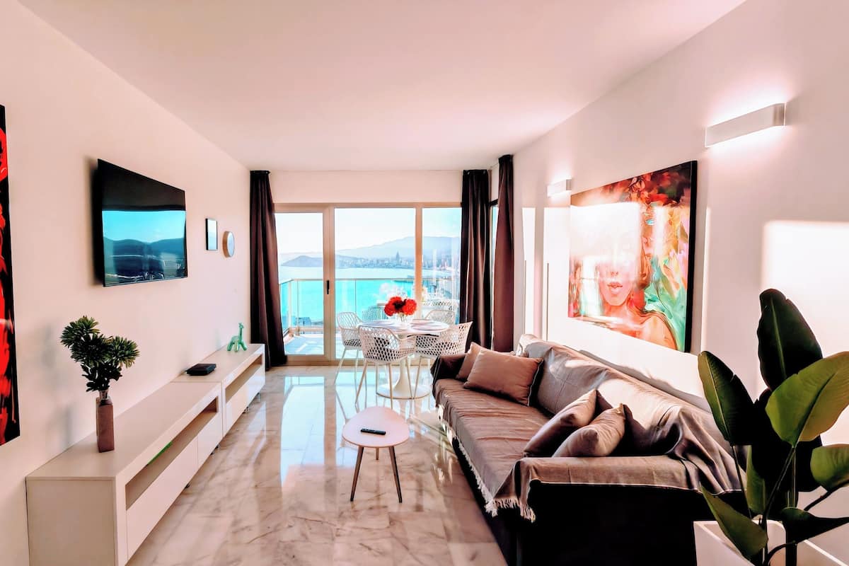 Signature Apartment, Sea View | Living area | 55-inch flat-screen TV with digital channels