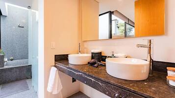 Bathtub, hair dryer, towels, soap